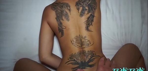  Tatted Thai babe with big fake tits and insatiable horniness